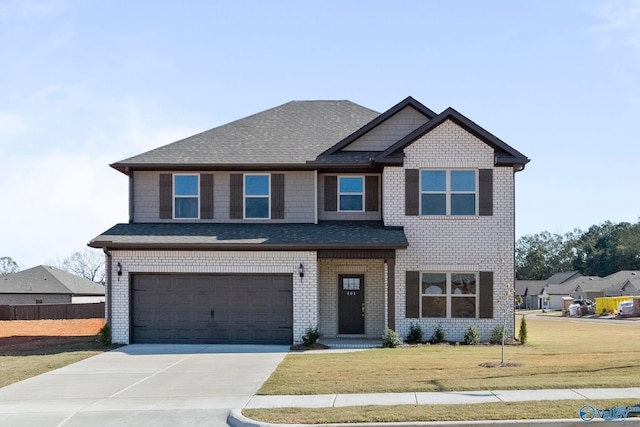 view of front facade featuring a front yard and a garage