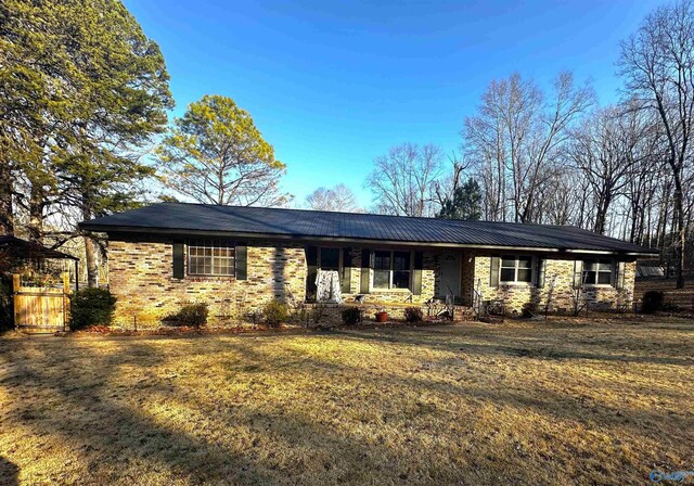 ranch-style house with a front yard