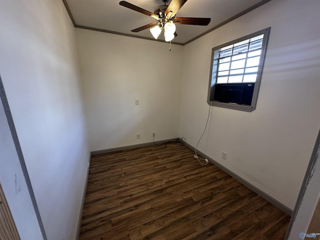 empty room featuring ornamental molding, ceiling fan, and dark hardwood / wood-style flooring