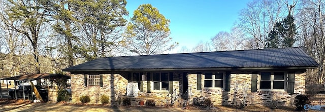view of front of home featuring a carport
