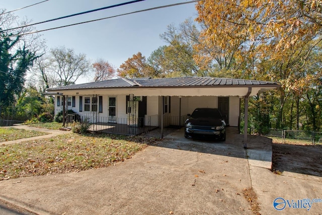 view of front of home with a carport and covered porch