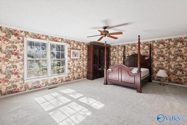 unfurnished bedroom with ceiling fan, crown molding, light carpet, and a textured ceiling