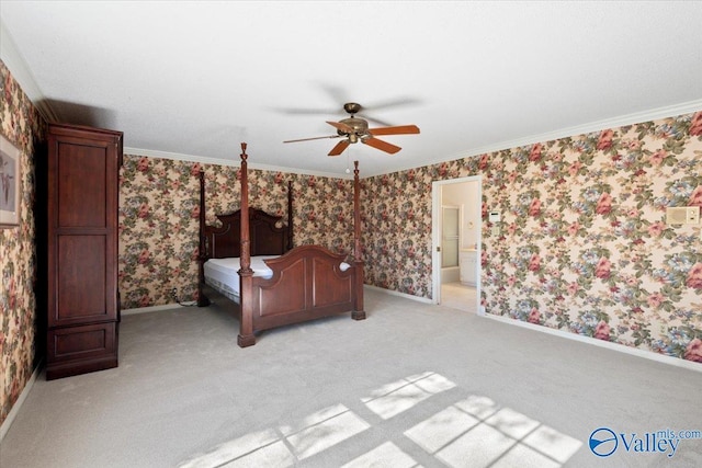 unfurnished bedroom featuring ensuite bathroom, ceiling fan, light colored carpet, and ornamental molding