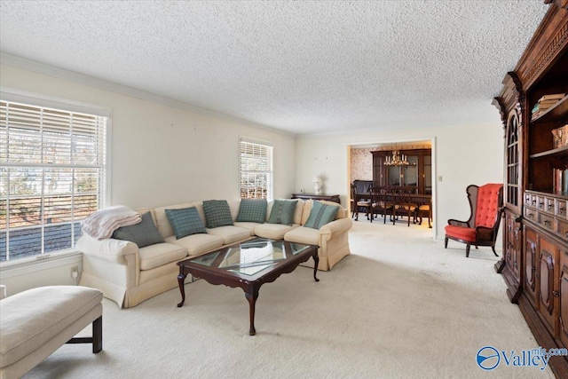 living room featuring light carpet, a textured ceiling, crown molding, and a notable chandelier