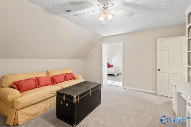 carpeted living room with a textured ceiling, ceiling fan, and lofted ceiling