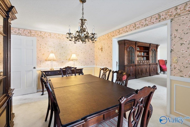 dining space featuring light carpet, an inviting chandelier, and ornamental molding