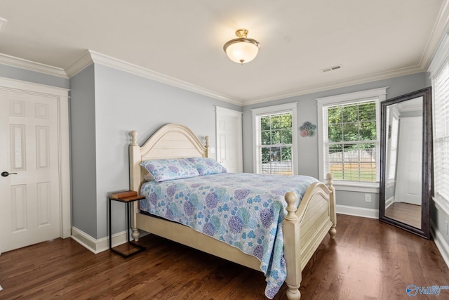 bedroom with ornamental molding and dark wood-type flooring