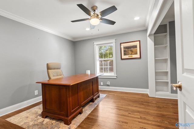 office area featuring ceiling fan, ornamental molding, and wood-type flooring