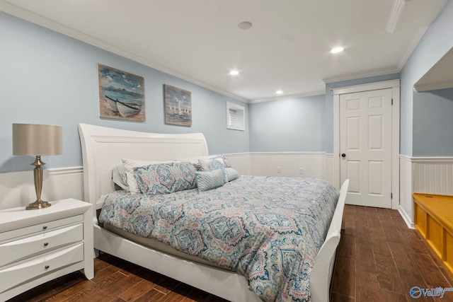 bedroom with a closet, dark hardwood / wood-style floors, and ornamental molding