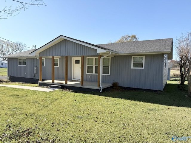 single story home featuring a porch and a front yard