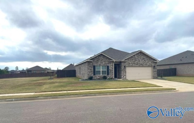 view of front of house with a garage and a front lawn