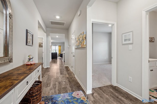 hallway featuring dark wood-type flooring