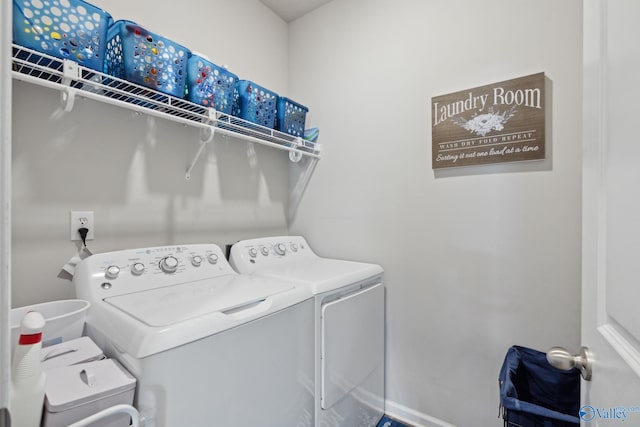 laundry area with independent washer and dryer