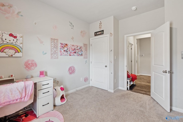 bedroom featuring light colored carpet