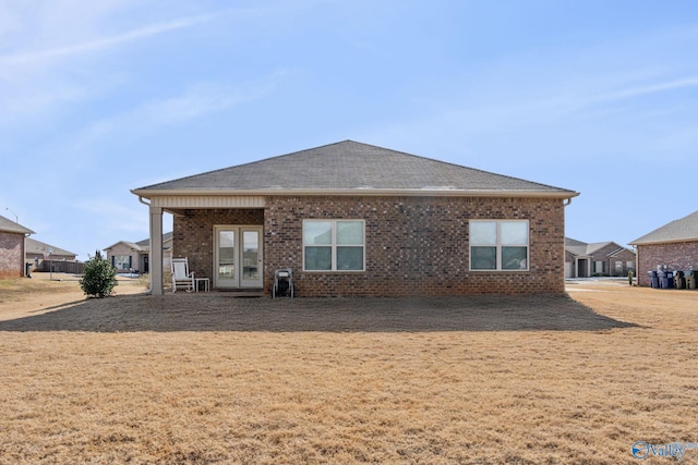 back of house featuring a yard