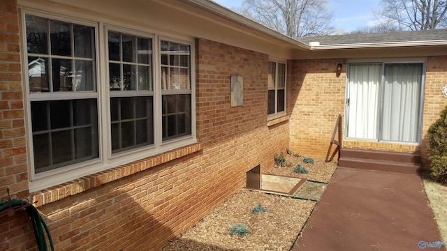 view of home's exterior with brick siding