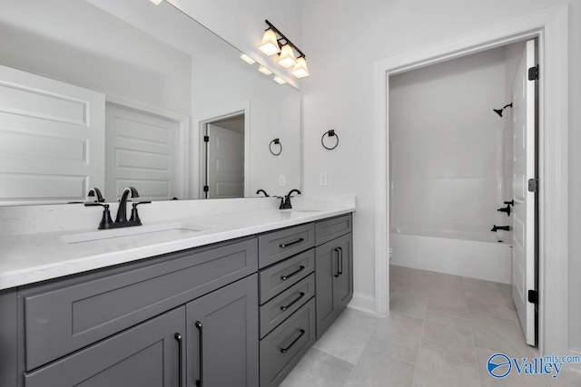 full bathroom featuring toilet, tile patterned floors, vanity, and bathtub / shower combination