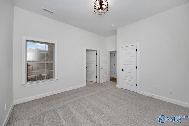 unfurnished bedroom with light carpet