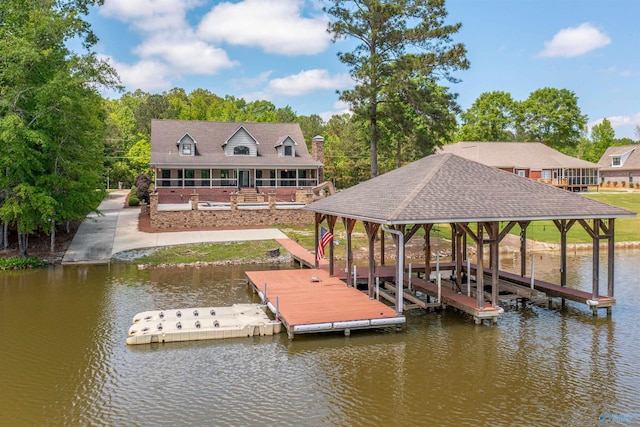 view of dock featuring boat lift and a water view