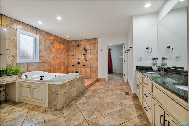 full bathroom featuring a tile shower, a sink, double vanity, recessed lighting, and a garden tub