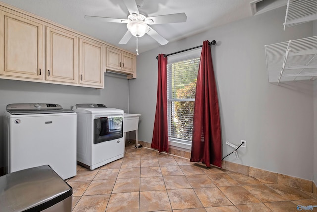 laundry area featuring a ceiling fan, cabinet space, and washing machine and clothes dryer