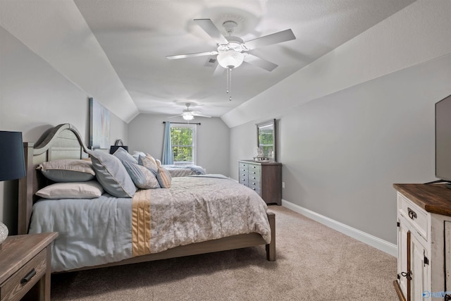 bedroom with baseboards, ceiling fan, lofted ceiling, and light carpet