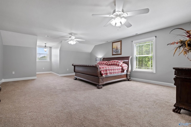 carpeted bedroom featuring baseboards, a ceiling fan, vaulted ceiling, and visible vents