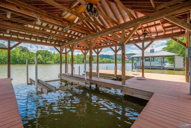 view of dock featuring a water view and boat lift