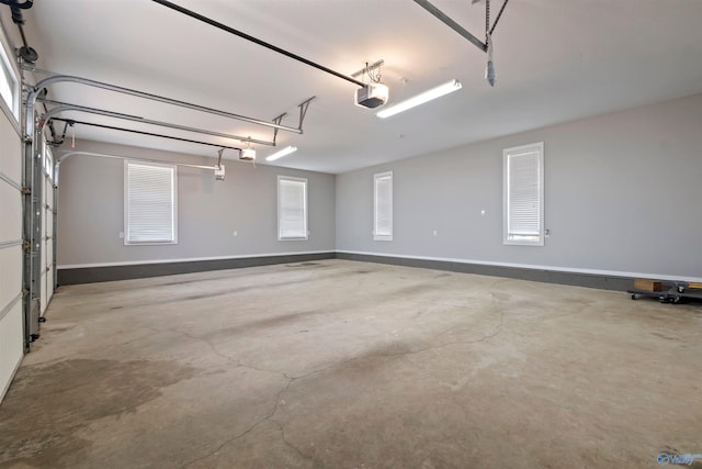garage featuring baseboards and a garage door opener
