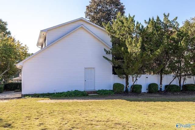 view of home's exterior featuring a lawn