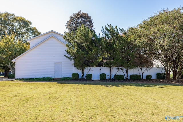 view of side of property with a yard