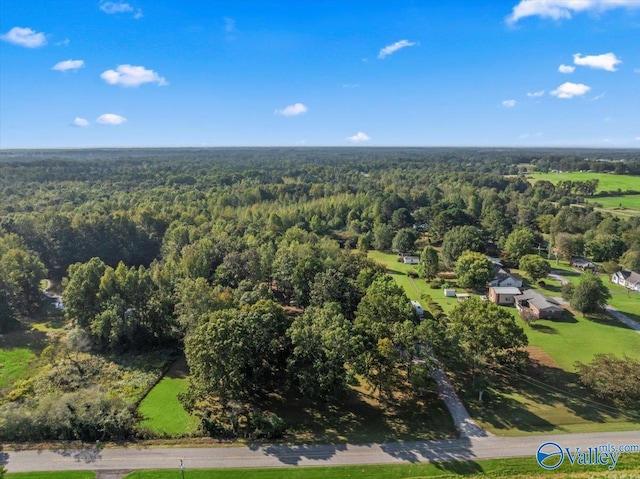birds eye view of property featuring a wooded view