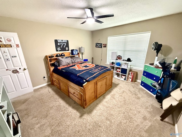 bedroom with light carpet, a textured ceiling, and a ceiling fan