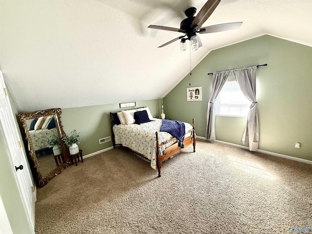carpeted bedroom featuring ceiling fan, lofted ceiling, baseboards, and a textured ceiling