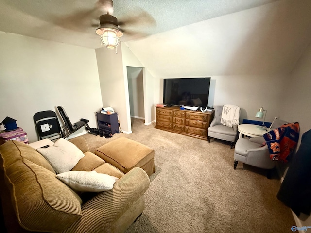 carpeted living area with a textured ceiling, ceiling fan, and vaulted ceiling