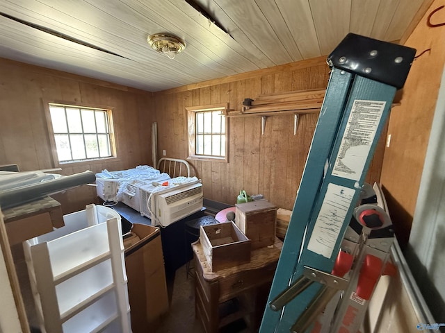 bedroom with wooden ceiling and wooden walls