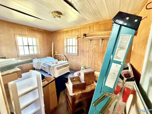 bedroom featuring wooden ceiling and wooden walls