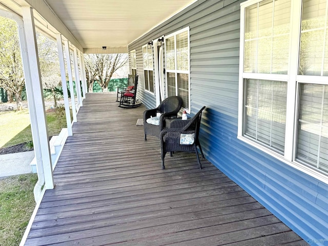 wooden terrace with a porch