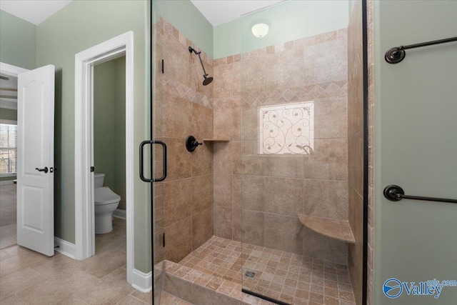 bathroom with toilet and walk in shower