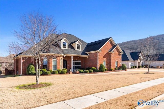 view of front of property with a mountain view