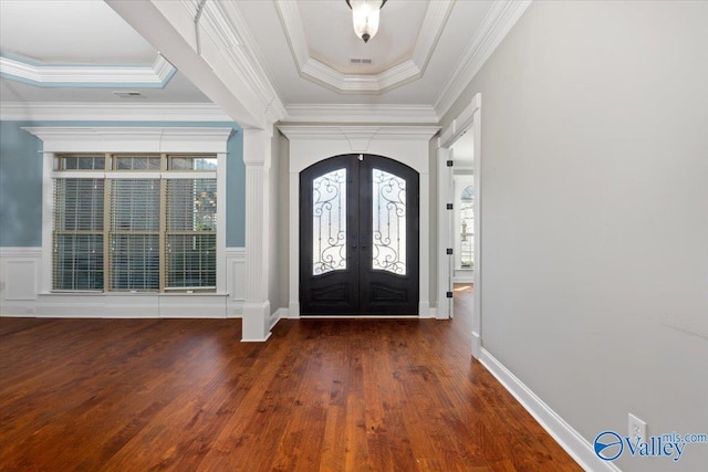 entryway featuring dark hardwood / wood-style flooring, french doors, ornamental molding, and a tray ceiling