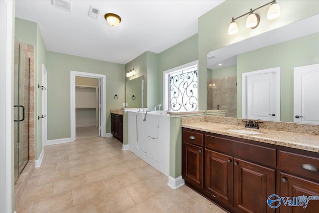 bathroom with vanity and walk in shower