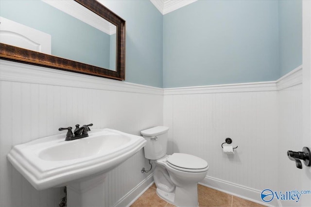 bathroom with tile patterned floors, toilet, and sink