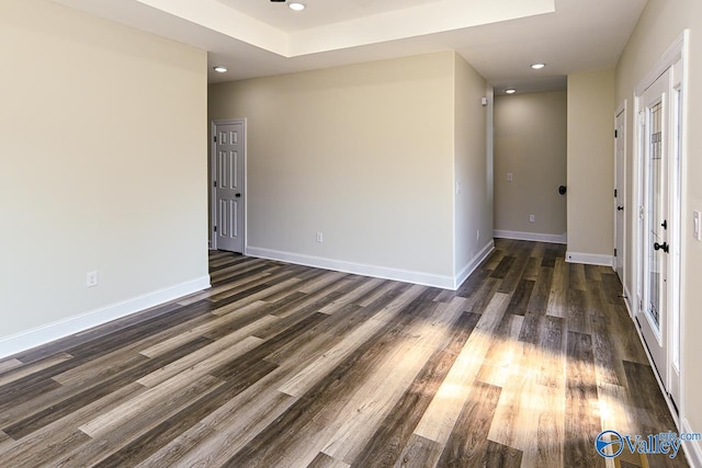 unfurnished room featuring dark hardwood / wood-style flooring