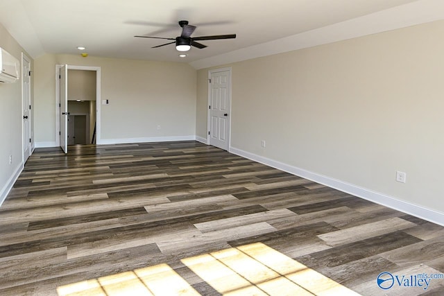 empty room featuring ceiling fan and dark wood-type flooring