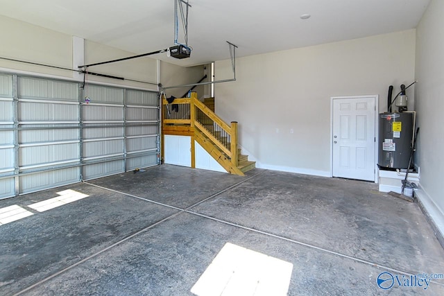 garage featuring a garage door opener and water heater