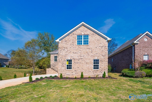 view of property exterior with a lawn