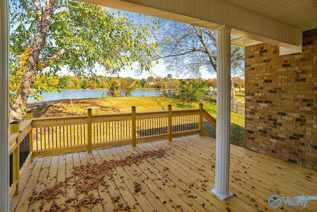 wooden deck featuring a water view