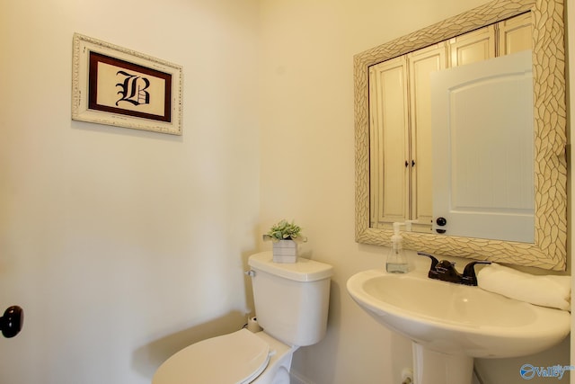 bathroom with sink and toilet