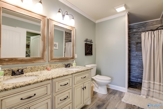 bathroom featuring vanity, hardwood / wood-style flooring, ornamental molding, and a shower with shower curtain